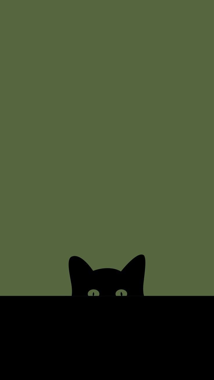 a black cat is peeking out from behind a green wall with the words, i'm not afraid to see what you are looking at