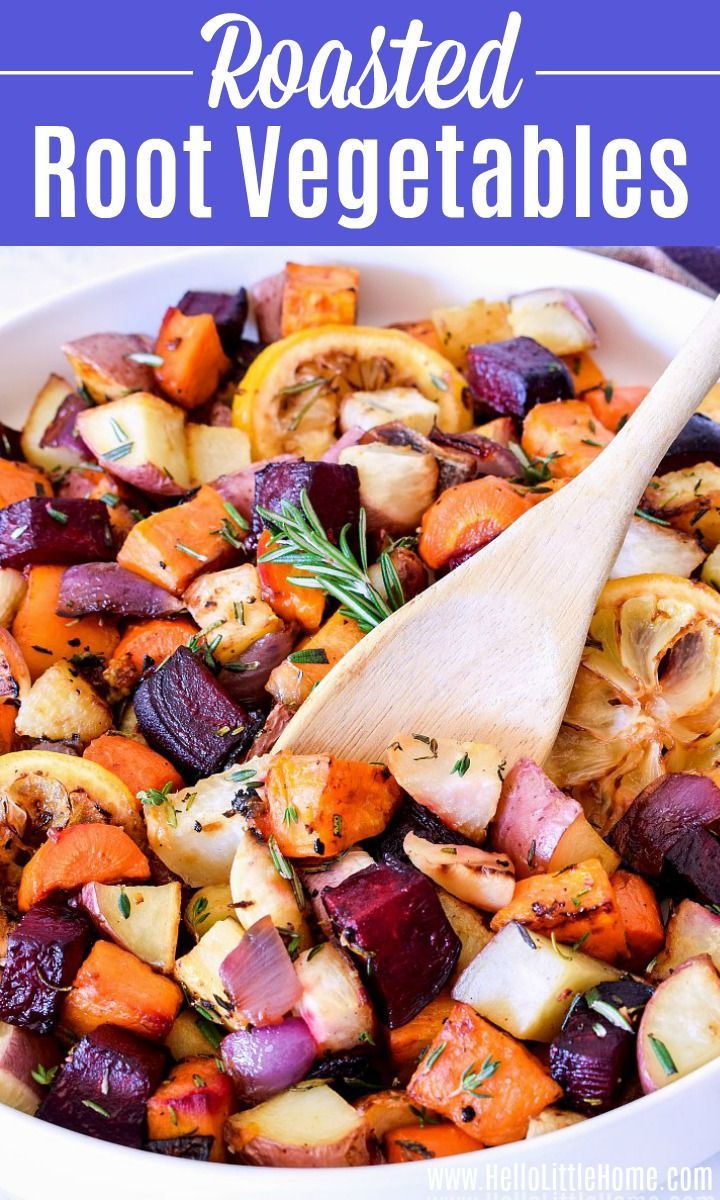 roasted root vegetables in a white bowl with a wooden spoon and title text reads roasted root vegetables