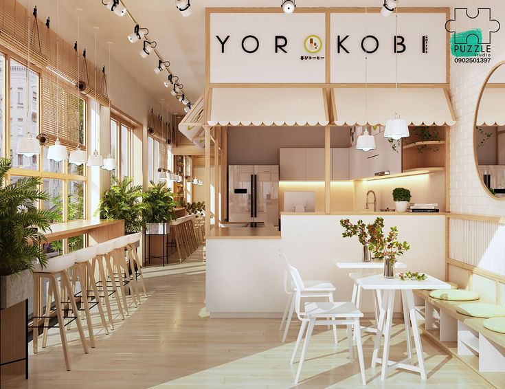 the interior of a restaurant with white tables and chairs, potted plants on the counter