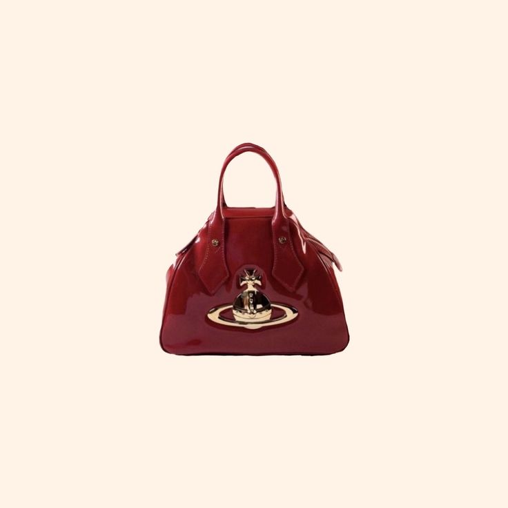 a red handbag with gold hardwares on the front and side, against a white background