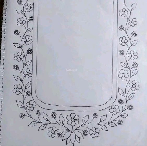 an open notebook with flowers and leaves on it