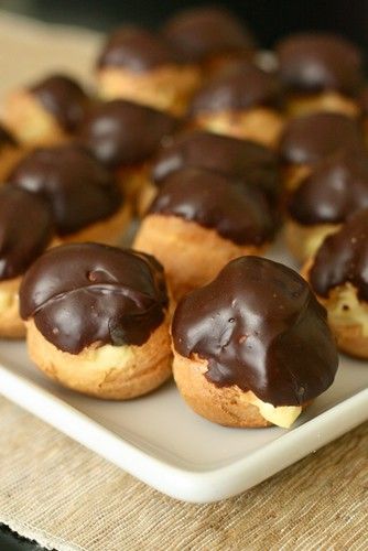 chocolate covered doughnuts on a plate ready to be eaten for lunch or dessert