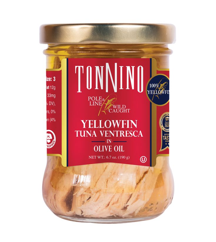 an open jar of yellowfin tuna in olive oil on a white background with the words tonnino written below it