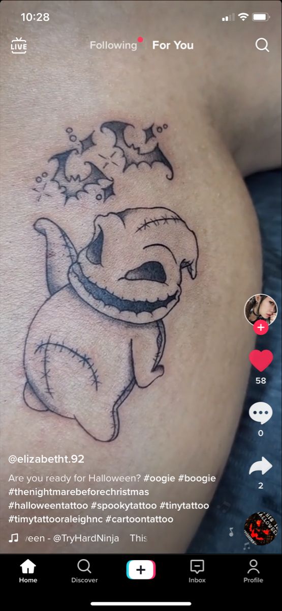 an image of a cartoon character tattoo on someone's stomach