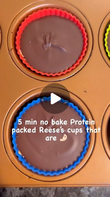 four cupcakes with chocolate frosting in a muffin tin, labeled 5 min no bake protein packed reese's cups that are