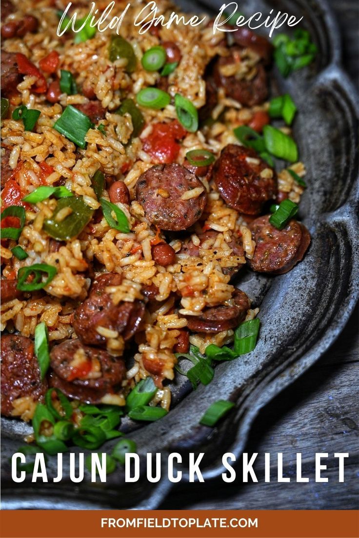 a close up of a plate of food with rice and sausage on it that says wild game recipe cajun duck skillet