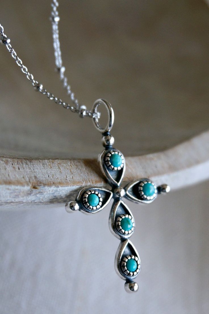 Details The Guilia Cross Necklace by Sowell Jewelry features a sterling silver pendant with genuine turquoise stones. Pendant: 39x24mm Length: 16-18"/22-24" All jewelry is final sale. Contents Solid 925 sterling silver Genuine turquoise Turquoise Cross Necklace In Sterling Silver, Turquoise Sterling Silver Cross Necklace, Turquoise Cross Sterling Silver Necklace, Bohemian Turquoise Cross Pendant Necklace, Sterling Silver Turquoise Necklace With Large Pendant, Turquoise Sterling Silver Cross Pendant Jewelry, Turquoise Sterling Silver Cross Pendant, Southwestern Silver Cross Pendant Necklace, Southwestern Style Silver Cross Pendant Necklace