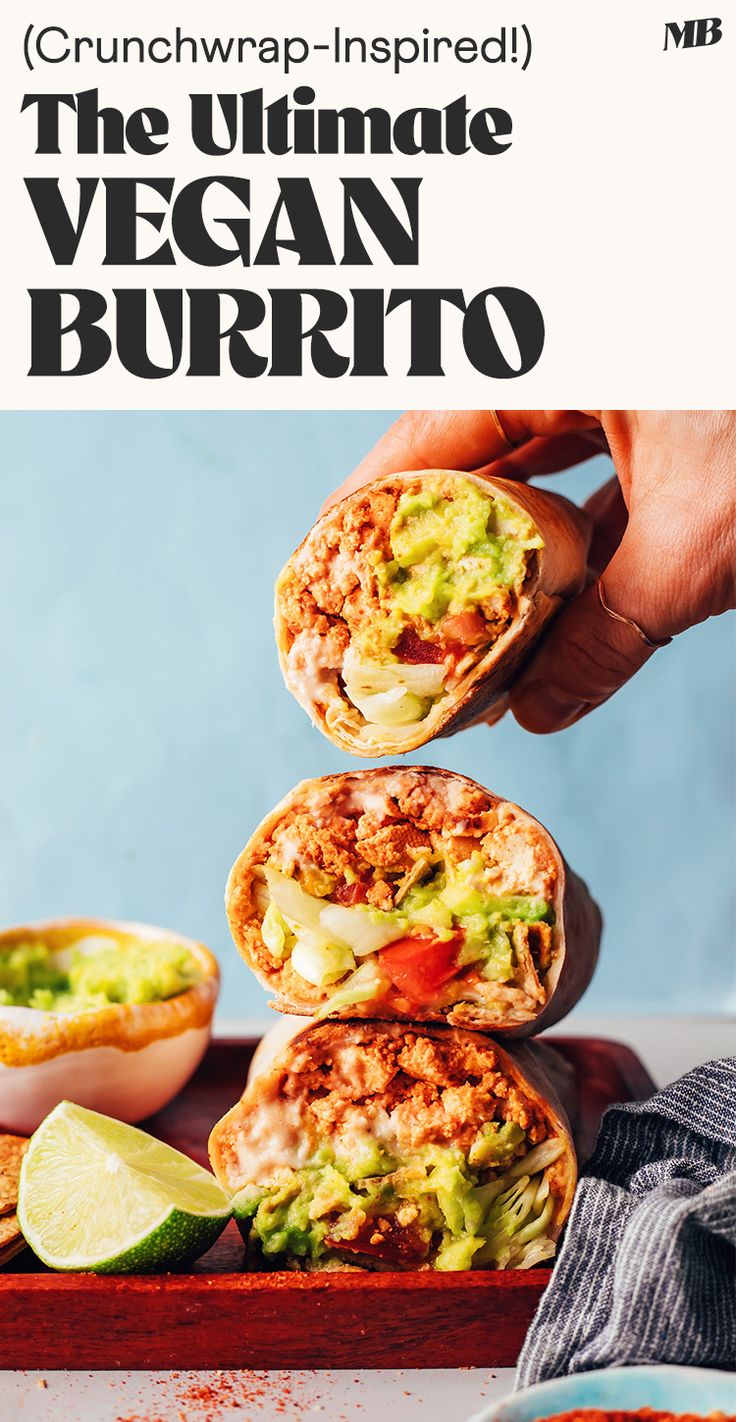 the ultimate vegan burrito is stacked on top of each other with guacamole and avocado