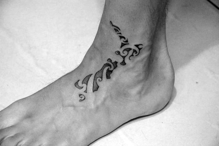 a person with a tattoo on their foot