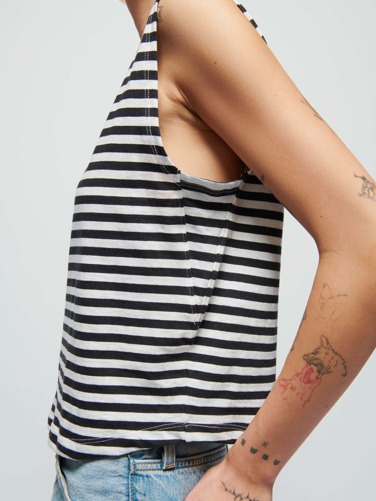 Featuring a classic crewneck, effortlessly draped fit, and a semi cropped length (for an effortless French tuck), it's the easiest muscle tee in your rotation. Trust us. (This one comes in black and white City Stripe.) | Women's Collins Tank Top in City Stripe | Ethical Essentials Chic Crew Neck Cropped T-shirt For Summer, Effortless Crew Neck Spring Top, Effortless Crew Neck Top For Spring, Chic Cotton Crew Neck Muscle Tee, Fitted Muscle Tee For Spring, Fitted Casual Muscle Tee For Spring, Fitted Muscle Tee For Everyday Spring Wear, Effortless Tops With Shirttail Hem, Effortless Top With Shirttail Hem