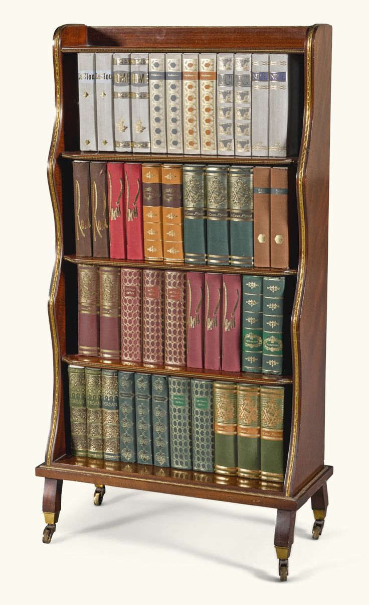 an old wooden bookcase with many books on it's sides and gold trimmings