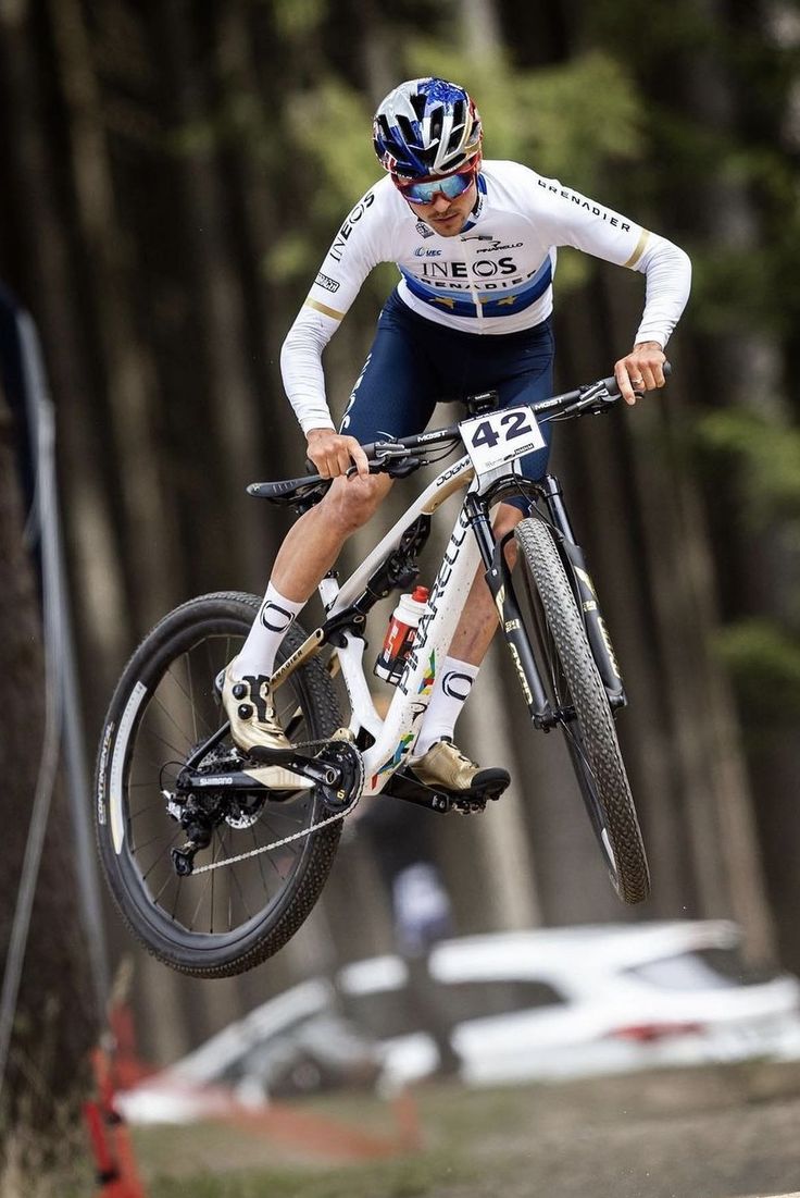 a man on a bike jumping in the air