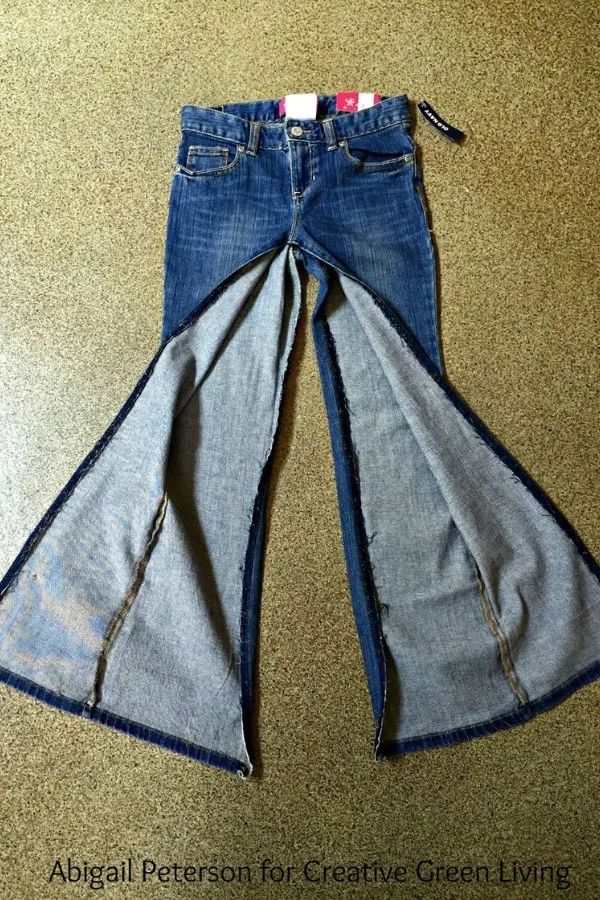 two jeans are folded up on top of each other, and the bottom has been torn off