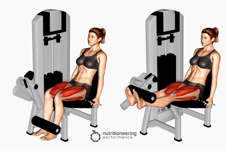 a woman sitting in a chair with her legs crossed and holding a barbell on the other side