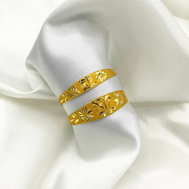 "Hand-Engraved Designs - the symbol represents fortune, blessing and luck. 24K SOLID GOLD (REAL GOLD, not gold-filled, not gold-plated) 1돈 Face Width: 8.75mm 1.5돈 Face Width: 10.85mm 2돈 Face Width: 12.95mm Bracelet Opening Width: 1.5\"-2.0\" (38-50mm) Dol (돌) is a Korean tradition that celebrates the first birthday of a baby. This ceremony blesses the child with a prosperous future and is of great significance in Korea. Customarily, these items are kept safely until the child reaches adulthood. Gold Bracelet With Decorative Band As Gift, Gold Bracelets With Decorative Band As Gift, Gold Bangle Bracelets For Promise, Gold Bracelet With Decorative Band For Anniversary, Elegant Thick Band Bracelet For Gift, Elegant Thick Band Bracelet As Gift, Luxury Open Band Bangle For Gift, Adjustable Yellow Gold Hallmarked Cuff Bracelet, Luxury Open Band Bangle As Gift