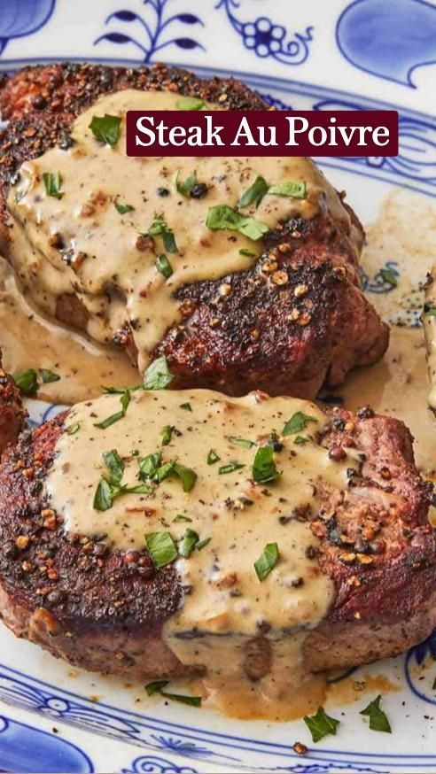 steak au poivre on a blue and white plate