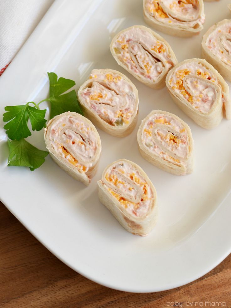 small appetizers are arranged on a white plate