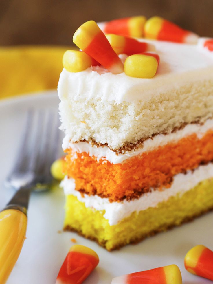 a slice of cake with candy corn on top