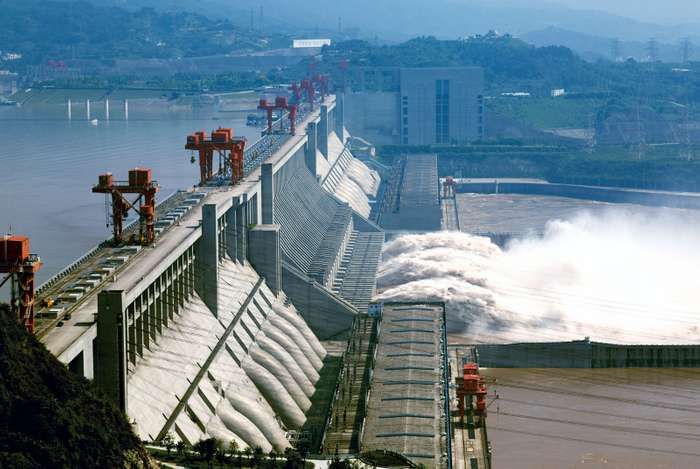 a dam with water pouring out of it