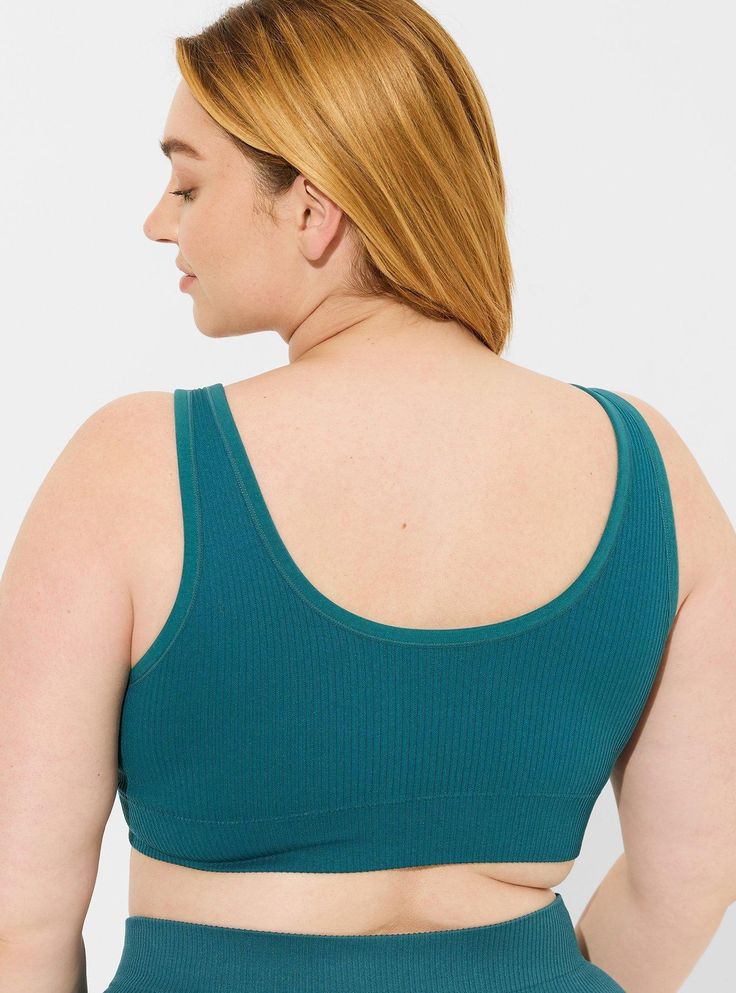 Matching style(s): 13886599 FIT Model is 5'10” wearing size 1. Light padding for support and shape. MATERIALS + CARE Ribbed knit fabric. 94% nylon, 5% spandex, 1% cotton. Wash cold; dry low. Imported. Details Front scoop neck. Back scoop neck. Fixed straps. Seamless construction for smooth look under clothes. The best plus size women's seamless scoop bralette bralettes in dark turquoise made of seamless. Scoop Neck Stretch Bra With Seamless Construction, Blue Medium Support Sports Bra With Scoop Neck, Blue Seamless Scoop Neck Sports Bra, Blue Seamless Stretch Sports Bra, Stretch Scoop Neck Bra With Medium Bust Support, Blue Bra With Medium Bust Support And Stretch, Blue Stretch Bra With Medium Bust Support, Blue Bra With Medium Bust Support, Blue Seamless Sports Bra With Flexible Fit