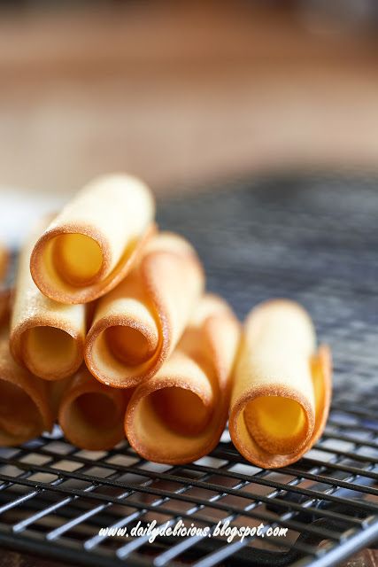 several pieces of food sitting on top of a metal grate