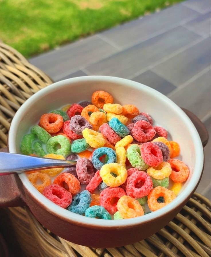 a bowl filled with cereal sitting on top of a table