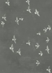 a flock of birds flying in the air over a chalkboard wall with writing on it