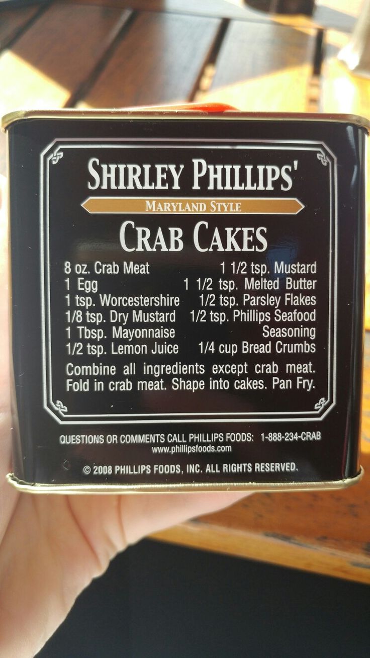 the label for shriley phillips's crab cakes is shown in front of a table