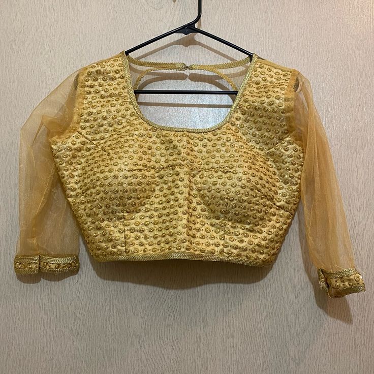 Beautiful Gold Sari/Saree Blouse Top. Made And Bought In Nepal. Nwot- Never Worn. Size: Check Measurements Which Can Be Seen In The Photo! Check Photos For Measurements And Verify Your Size Before Purchasing. Due To Differences In Screens, Phone Quality, And Lighting- Exact Color Of The Item May Not Be Shown Through This Digital Listing. Measurements Are Taken Manually And May Not Be Exact. All Items Are Sold As Is. Please Check Out My Closet And Create A Bundle To Receive An Instant Discount! L Lehenga Top, Choli Blouse, Bollywood Lehenga, Gold Blouse, South Asian Wedding, Asian Wedding, Lehenga Choli, Saree Blouse, Indian Wear