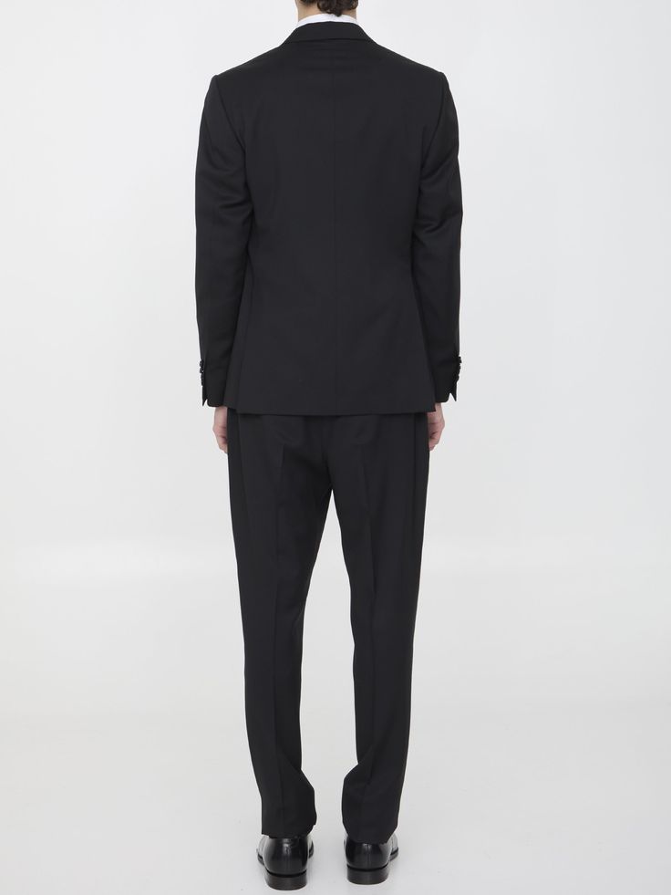 Two-piece suit in black wool. The jacket features classic lapels with brooch on lapel, single-breasted closure, two front welt pockets, a welt pocket on chest and buttoned cuffs. Straight-leg trousers with zip and button closure, two side welt pockets, two rear buttoned welt pockets and belt loops. Regular fit. The model is 184cm tall and wears size IT 50.Size nationality: IT Product number: 6734827 Product code: EQ7754SK62403999 Composition: 100% WOOL Formal Pantsuit With Double Button Closure And Lapel Collar, Classic Black Pantsuit For Semi-formal Occasions, Tailored Wool Blazer For Black-tie Events, Wool Single Breasted Blazer For Black-tie Events, Wool Single-breasted Blazer For Black-tie Events, Formal Tuxedo Pantsuit With Lapel Collar, Tailored Single-breasted Blazer For Black-tie Events, Classic Black Tuxedo With Lapel Collar, Wool Blazer For Black-tie Events With Notch Lapel