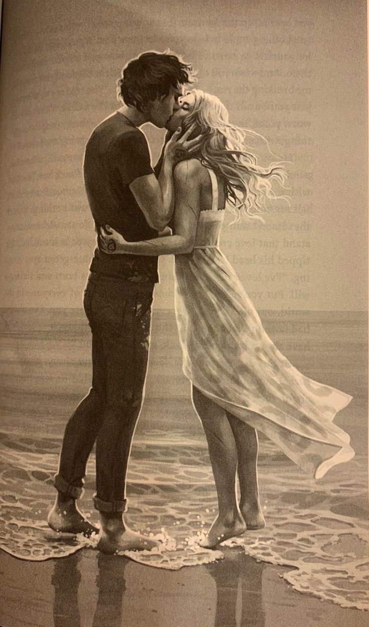 a man and woman kissing on the beach in front of an open book with text