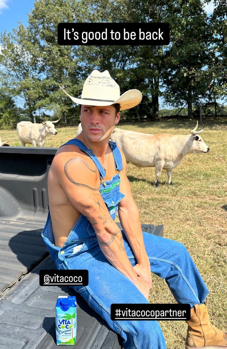 a man sitting in the back of a truck with cows behind him and an ad that reads, it's god to be back