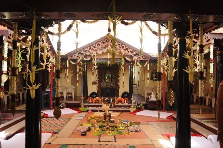 the inside of a building decorated with garlands and decorations for diwaling or decorating