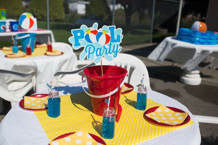 a party table set up for a pool party