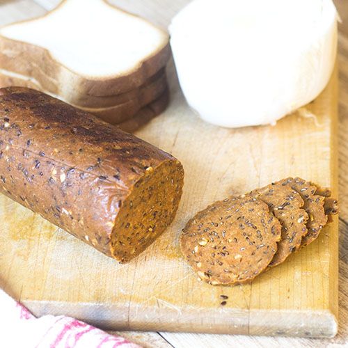 some bread is on a wooden cutting board