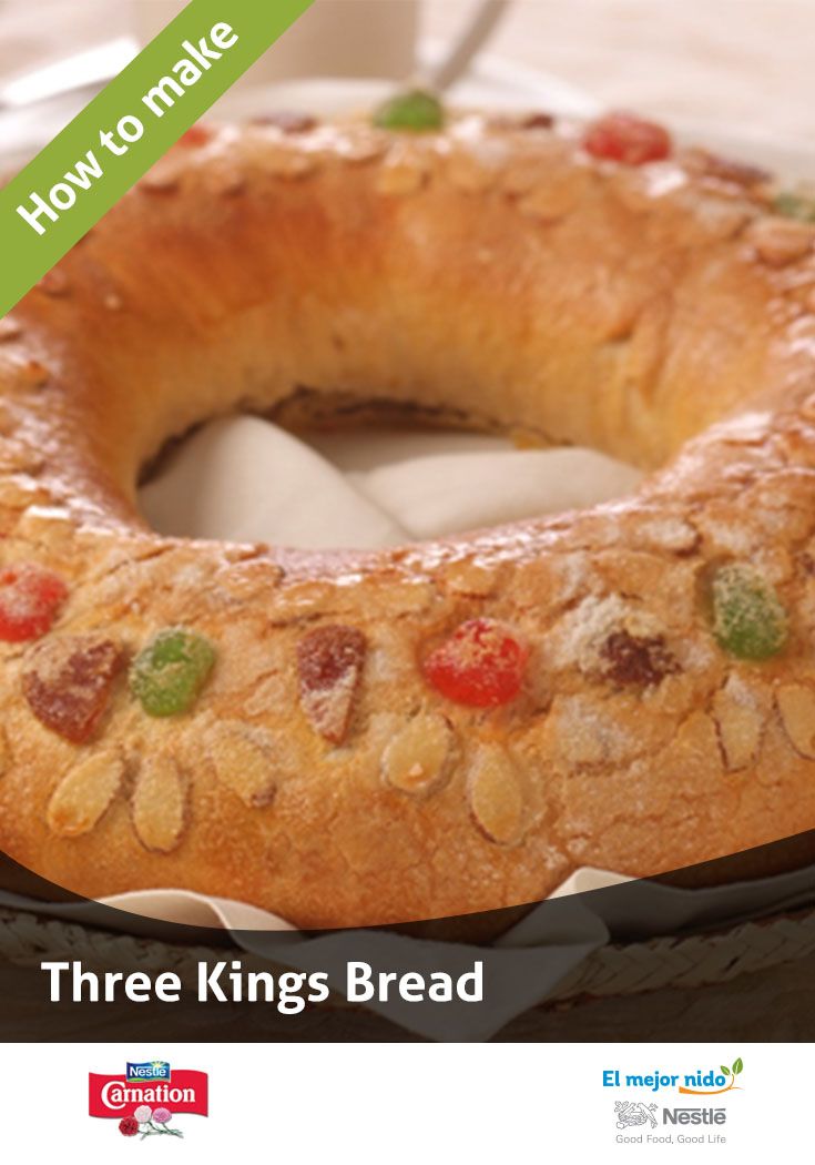 a bundt cake sitting on top of a table next to a glass of milk