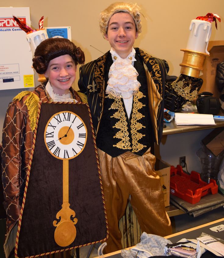 two people dressed in costumes standing next to each other