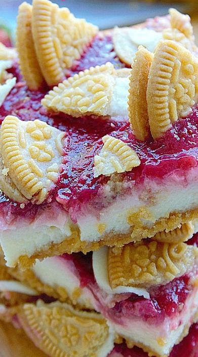 a stack of cookies and jelly desserts on top of each other with crackers in the middle