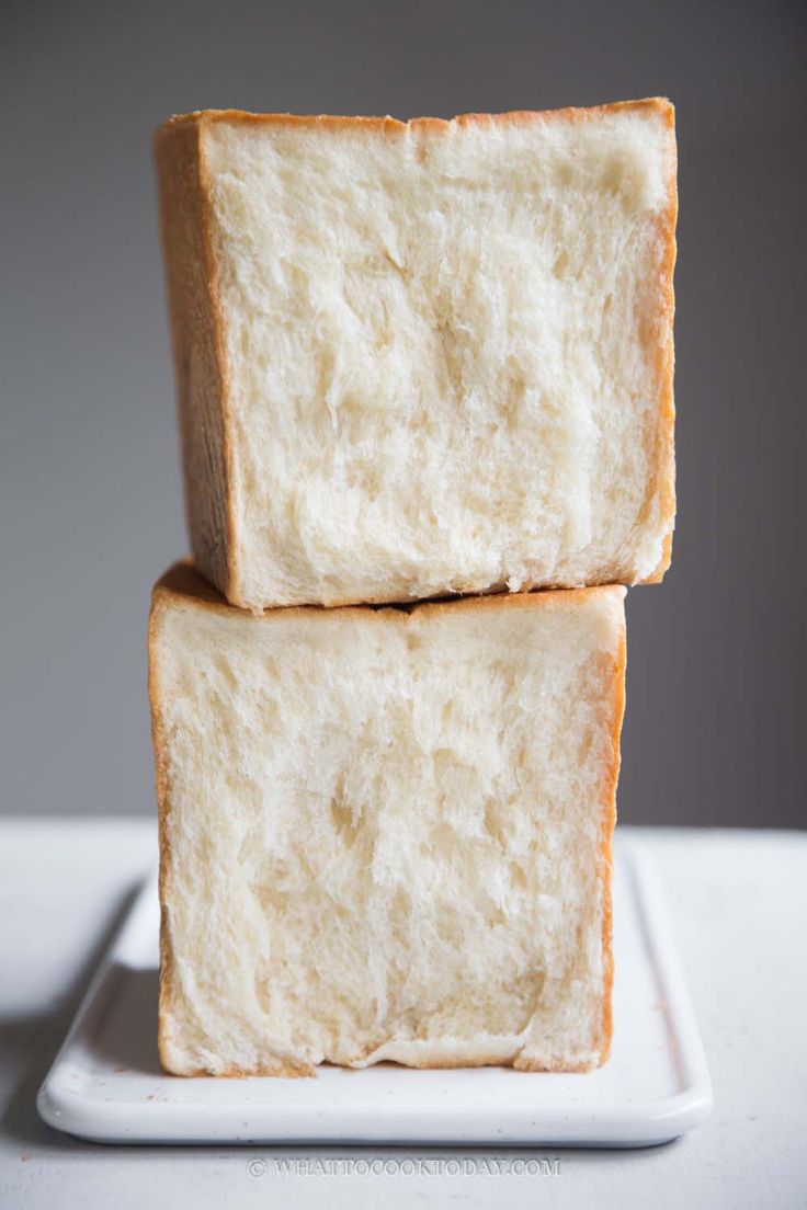 two slices of white bread stacked on top of each other