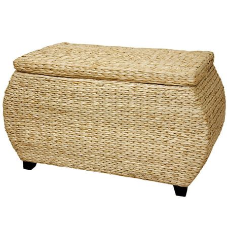 a large wicker ottoman with black legs and a lid on it's side