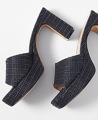 Step into sophistication with the Ann Taylor Platform Mule Sandals, a perfect blend of style and comfort for the modern woman. These sandals feature:

- Size: 8
- Color: Black
- Gender: Female
- Material: 45% Cotton, 35% Nylon, 20% Jute
- Open toe design
- Padded footbed for enhanced comfort
- Heel Height: 3 1/4 inches

Crafted from a textured leather-like blend of cotton, nylon, and jute, these platform mules offer a chic look with a substantial heel to elevate any outfit. Whether you're headin Chic Open Toe Mules With Textured Sole, Modern Heels With Textured Sole For Summer, Chic Block Heel Sandals With Textured Sole, Chic Heels With Textured Footbed, Modern Heels With Textured Footbed And Round Toe, Formal Summer Mules With Textured Sole, Chic Mules With Textured Footbed And Round Toe, Chic Wedge Heels With Textured Footbed, Chic Round Toe Mules With Textured Footbed