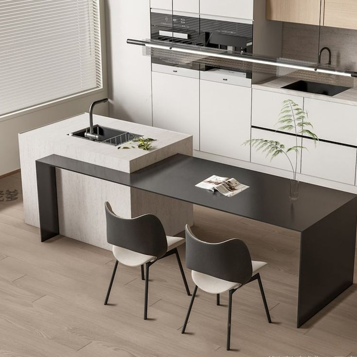 a modern kitchen with white cabinets and black counter tops, along with two chairs that are facing each other