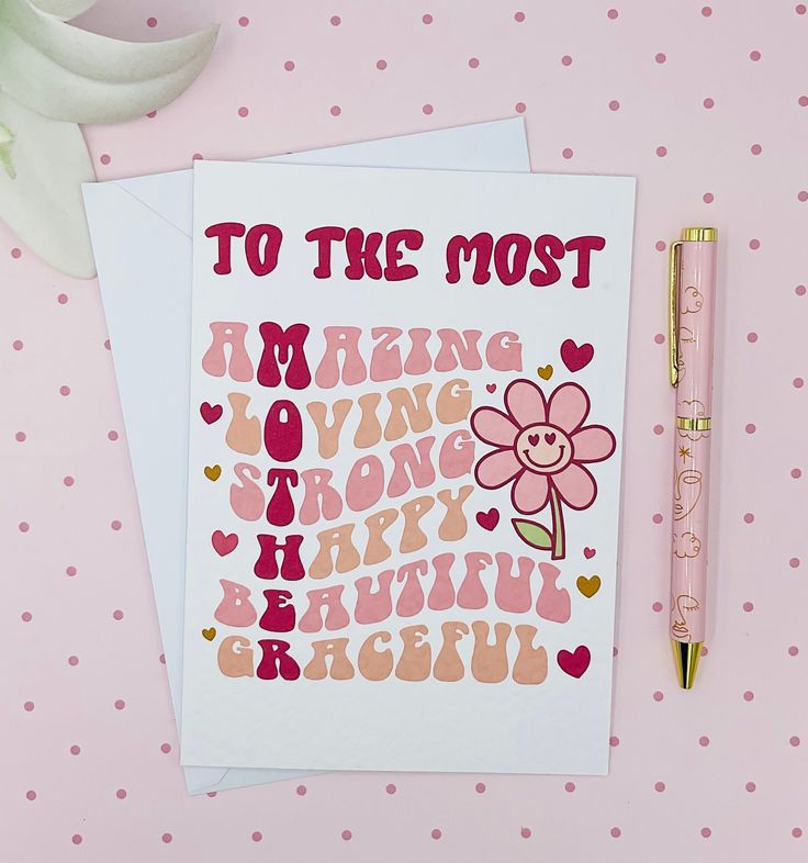 two greeting cards with the words to the most amazing loving moms are displayed next to a pen