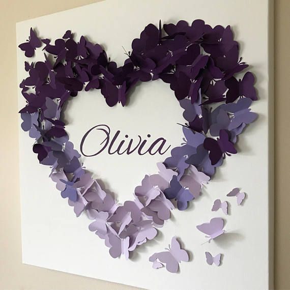 a heart made out of purple butterflies with the name julia written on it in cursive writing