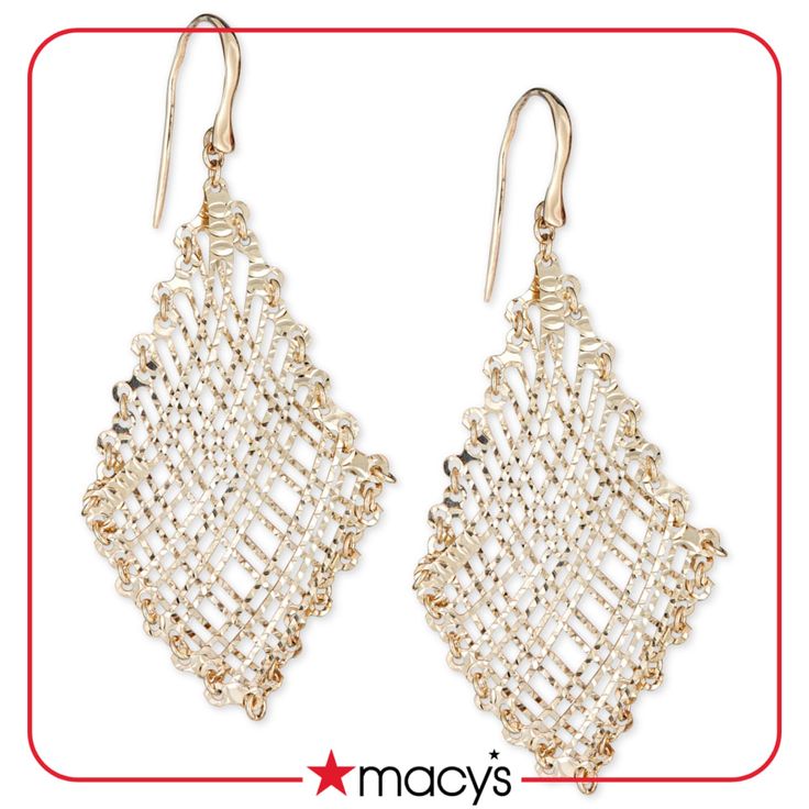 pair of gold tone earrings with white beading on the front and back ends, hanging from