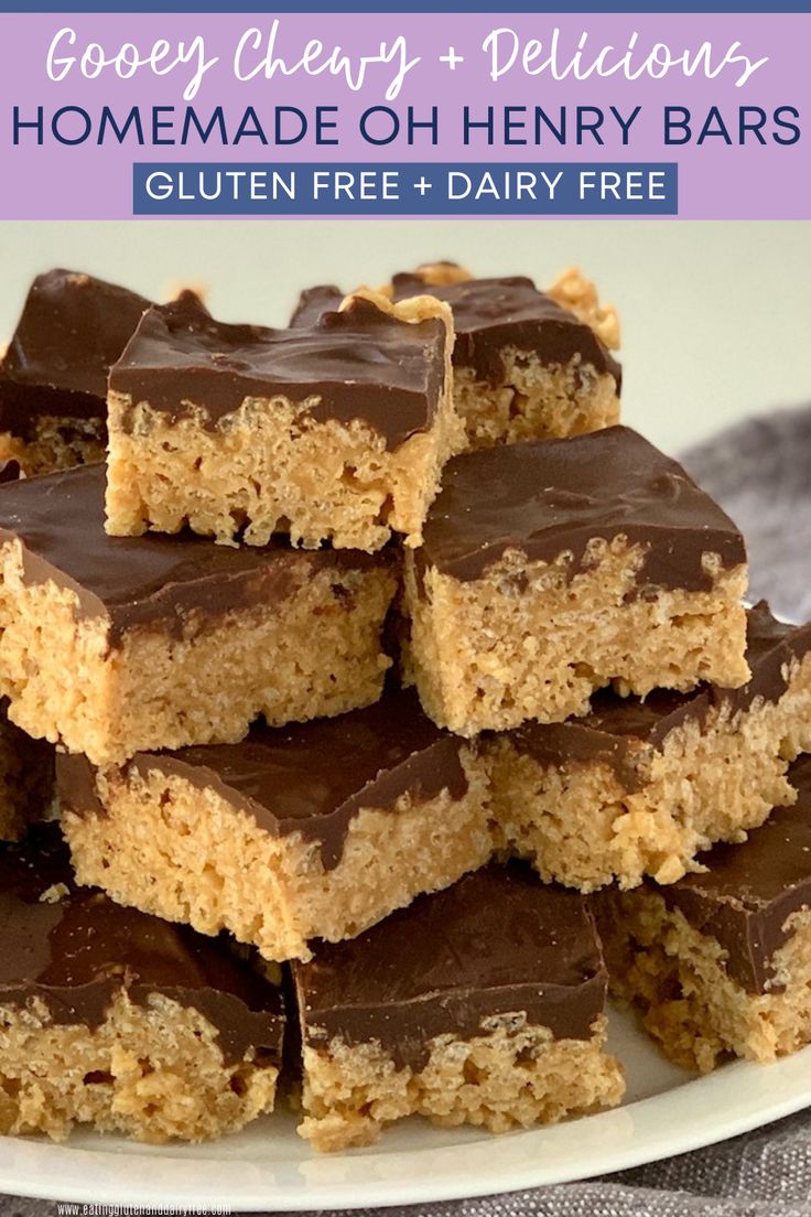 new year's eve dessert bars with chocolate frosting on a plate next to candy sticks