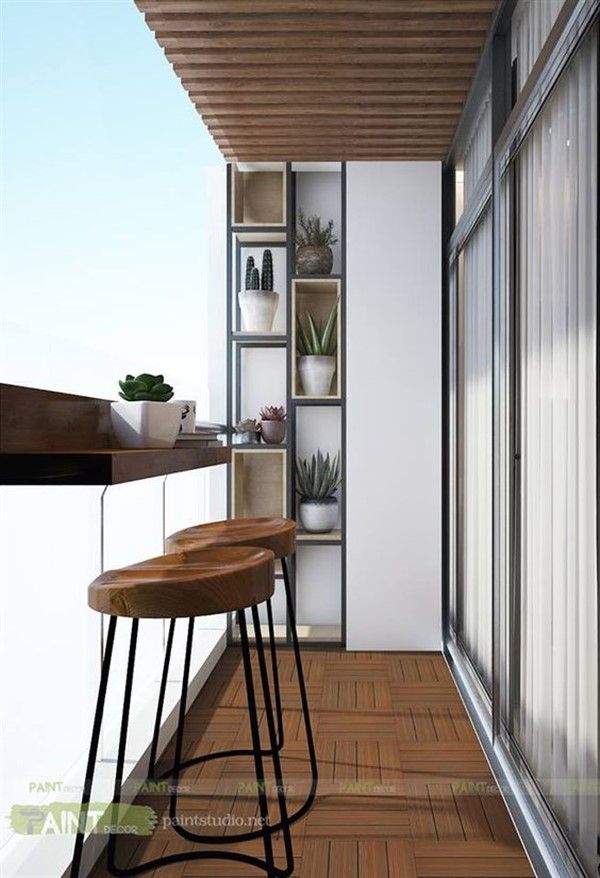 two wooden stools sitting on top of a hard wood floor next to a window