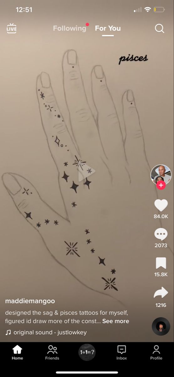 an image of someone's hand with stars on it