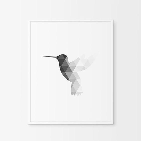 a black and white photo of a hummingbird