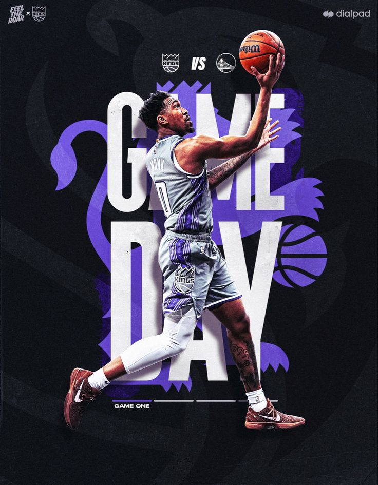 the basketball player is going to dunk the ball in front of an advertisement for game day